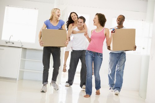 Student moving van and packed boxes outside an Ilford property