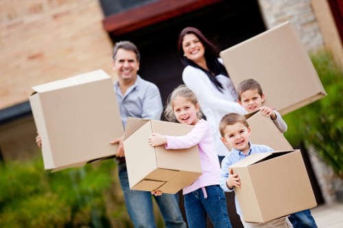 Careful unloading of household items at a new home in Ilford