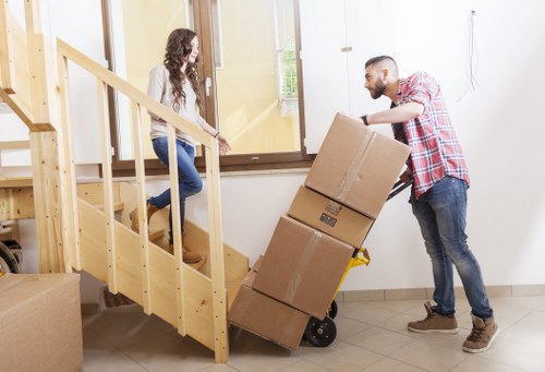 Careful lifting and transport of bulky items during an urgent Ilford removal