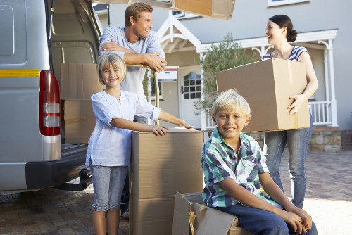 Removal van loading items near an Ilford property