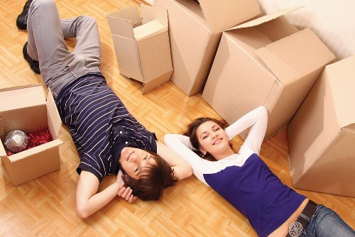 Careful loading of household furniture into a removals vehicle