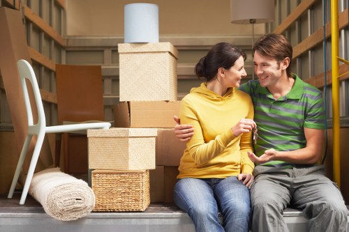 Professional movers handling furniture for an Ilford relocation
